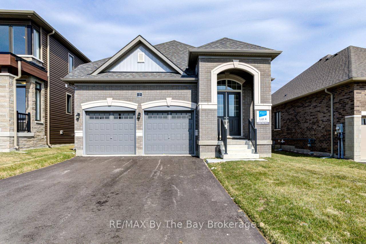 All brick, newly built 1, 649 sq ft bungalow by Zancor Homes.