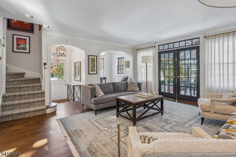 Custom expanded ranch renovated in 2020 with fabulous architectural detail and millwork throughout.