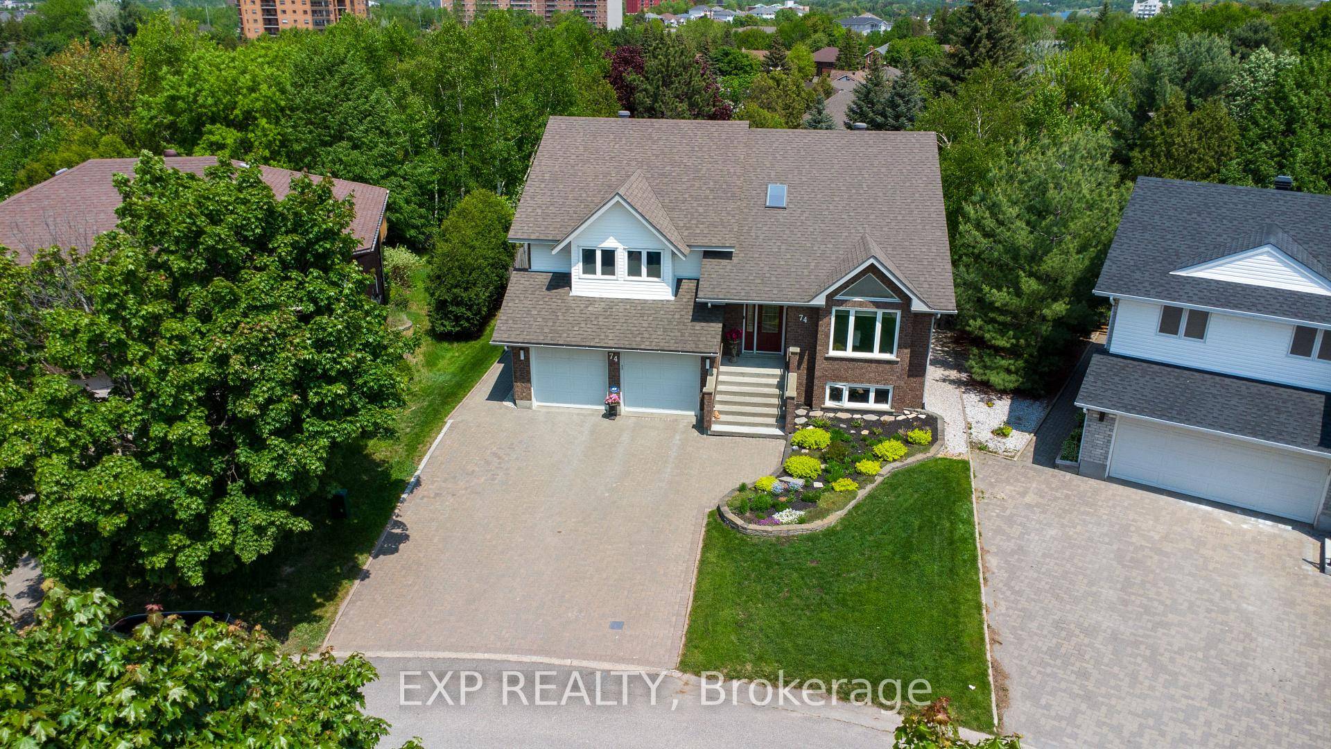 A TRULY EXCEPTIONAL RAISED RANCH BACKING ONTO A PARK WITH HIGH END FINISHES AND IMPECCABLE LANDSCAPING.