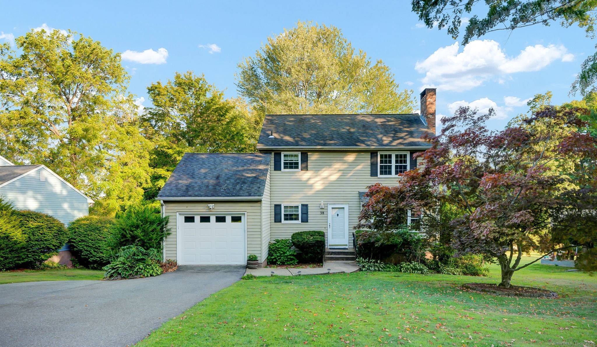 Opportunity awaits in this colonial style home with walkout lower level !