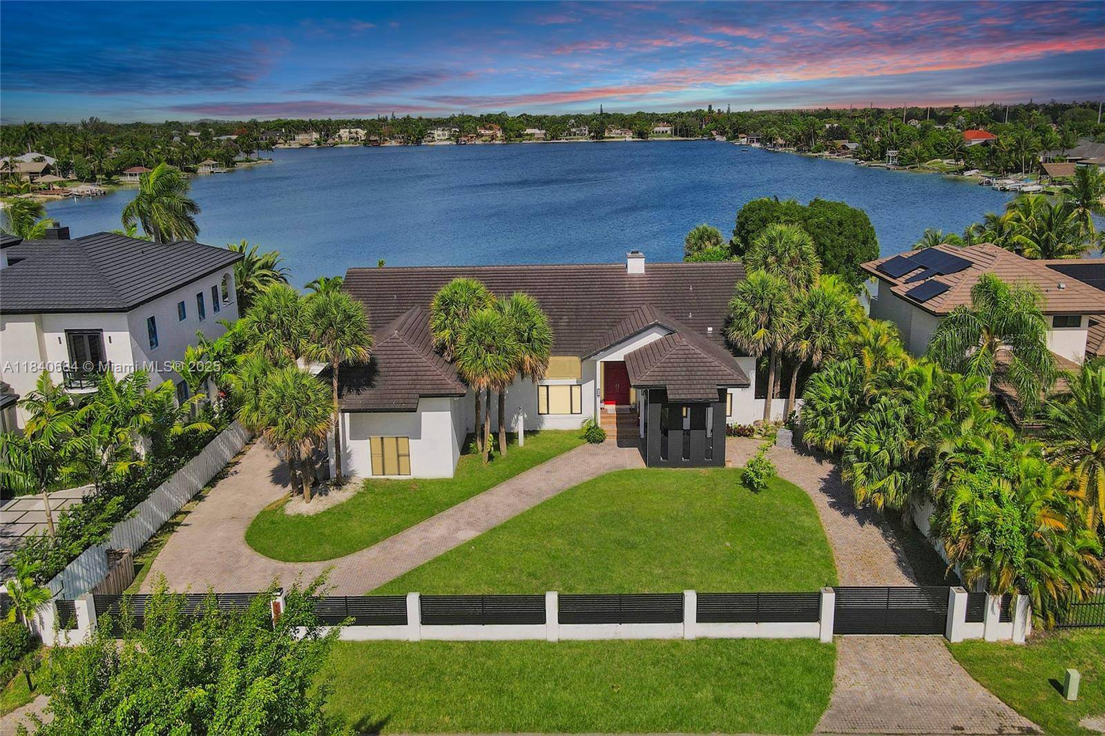 This isn't just a home ; it's an expansive retreat on E Lake, one of Miami's only operable lakes.