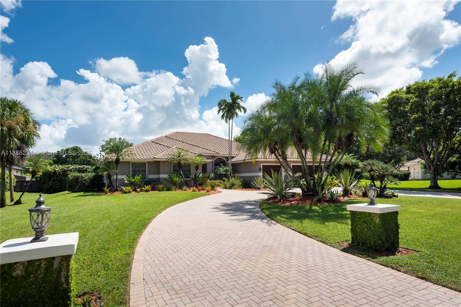 Welcome to your dream home in central Plantation Acres !