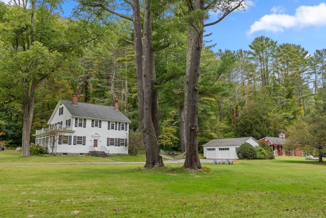 Set on 13 tranquil acres with privileged access to the Housatonic River, this gracious Salisbury property offers an exceptional country retreat in the heart of Connecticut's Litchfield Hills.