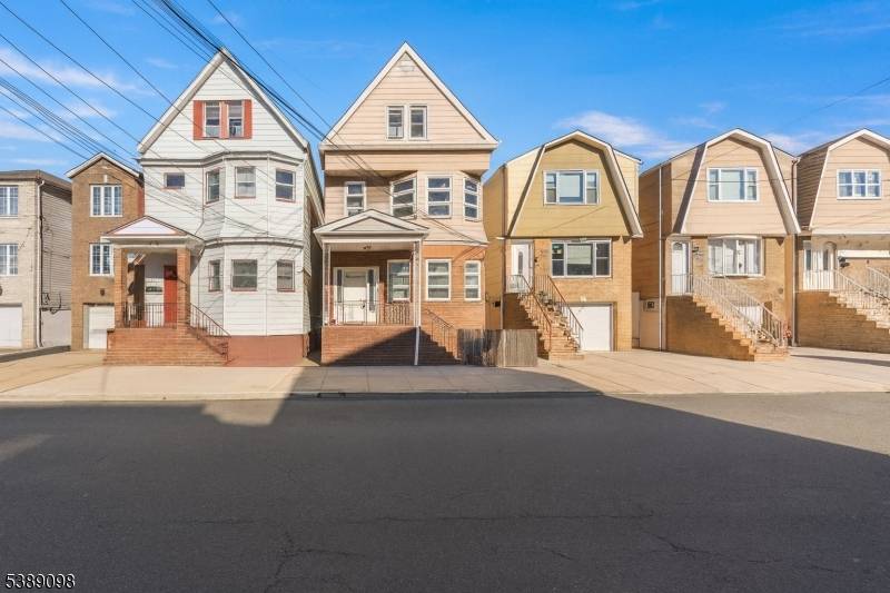 Welcome to this well maintained and income producing legal 2 family home in Harrison, boasting a total of 2, 900 sq.