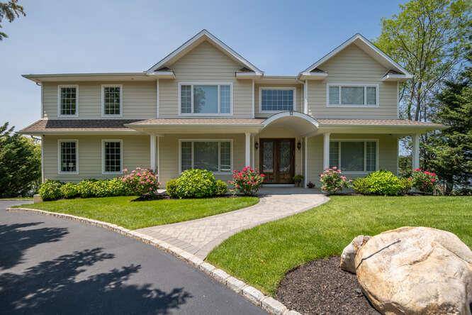 Privately set at the end of a quiet cul de sac, this builder owned colonial, completed in 2020, offers over 7, 000 sq.