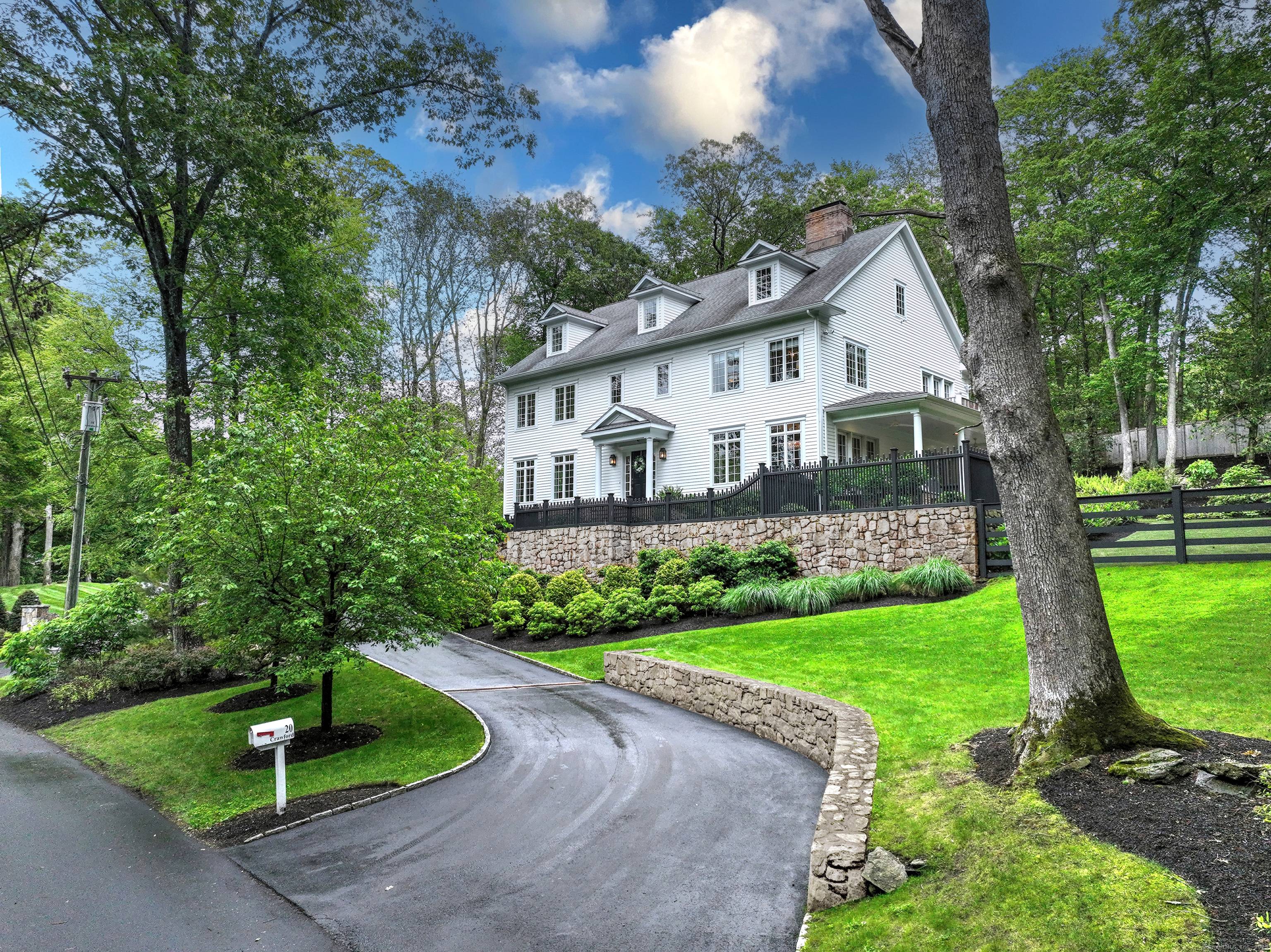 Nestled in Westport's coveted Old Hill neighborhood, this stunning residence blends classic Colonial design w modern amenities.