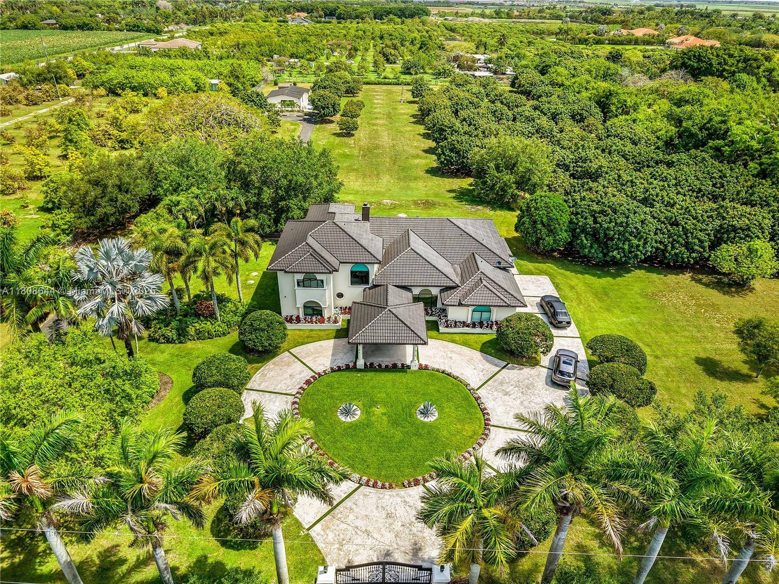 Stunning Redlands Estate Nestled on expansive 5 acre lot, this custom 4BD 3.