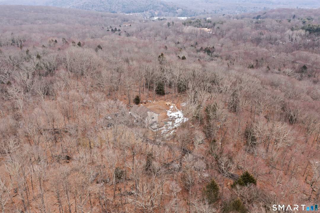 Set well back from the road at the end of a long driveway, this 6 acre property offers exceptional privacy and peaceful surroundings just minutes from town.