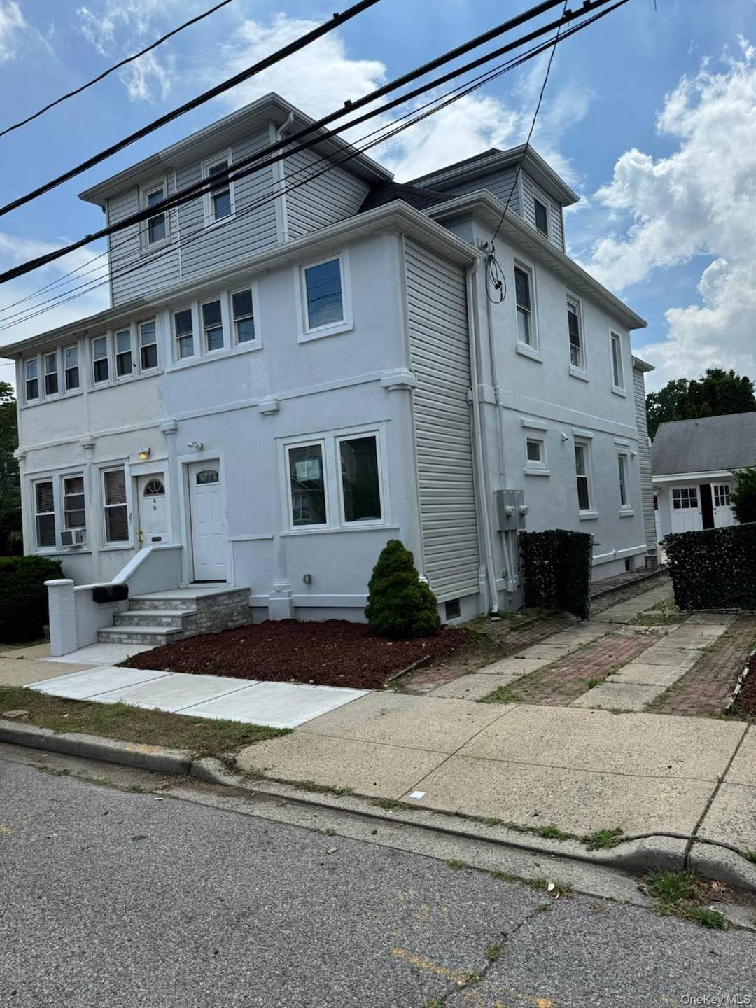 Beautifully renovated 2 family home with private driveway and garage.