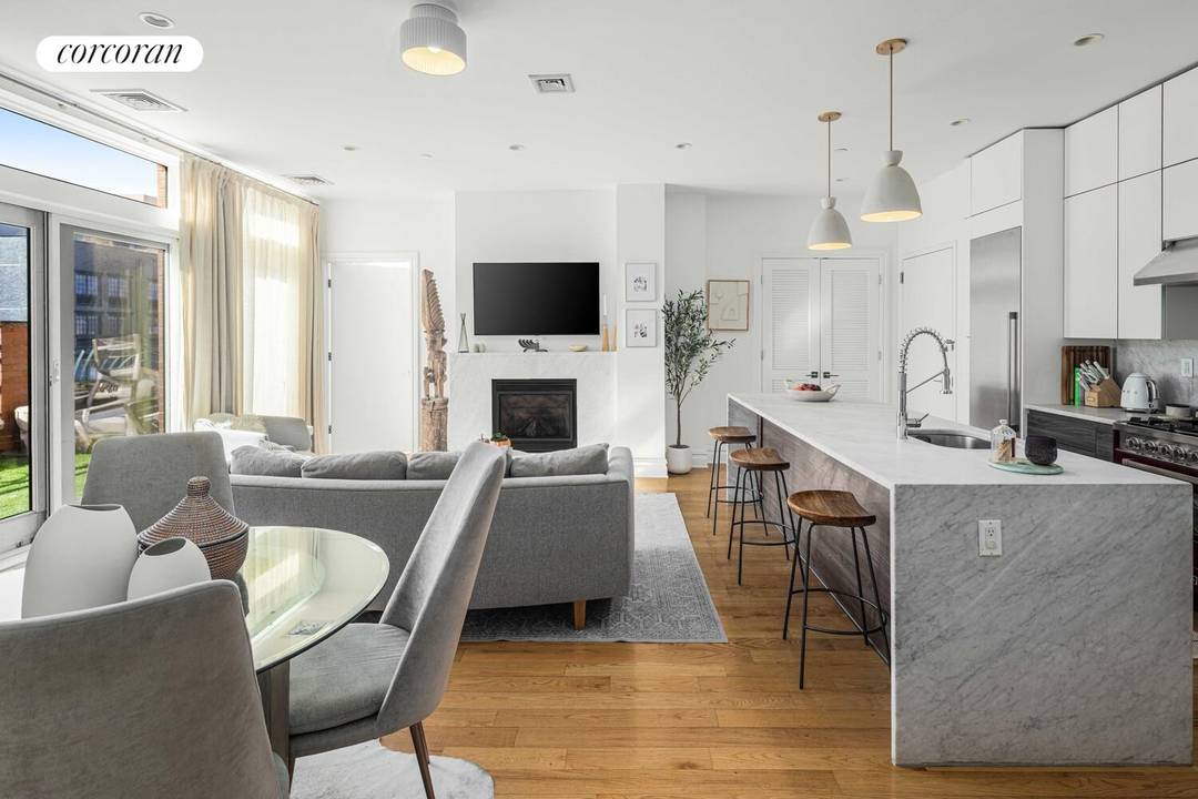 Welcome to Penthouse 701 at 525 Myrtle Ave a setback two bedroom, two bathroom residence perched atop a wonderful 22 unit condo in historic Clinton Hill.