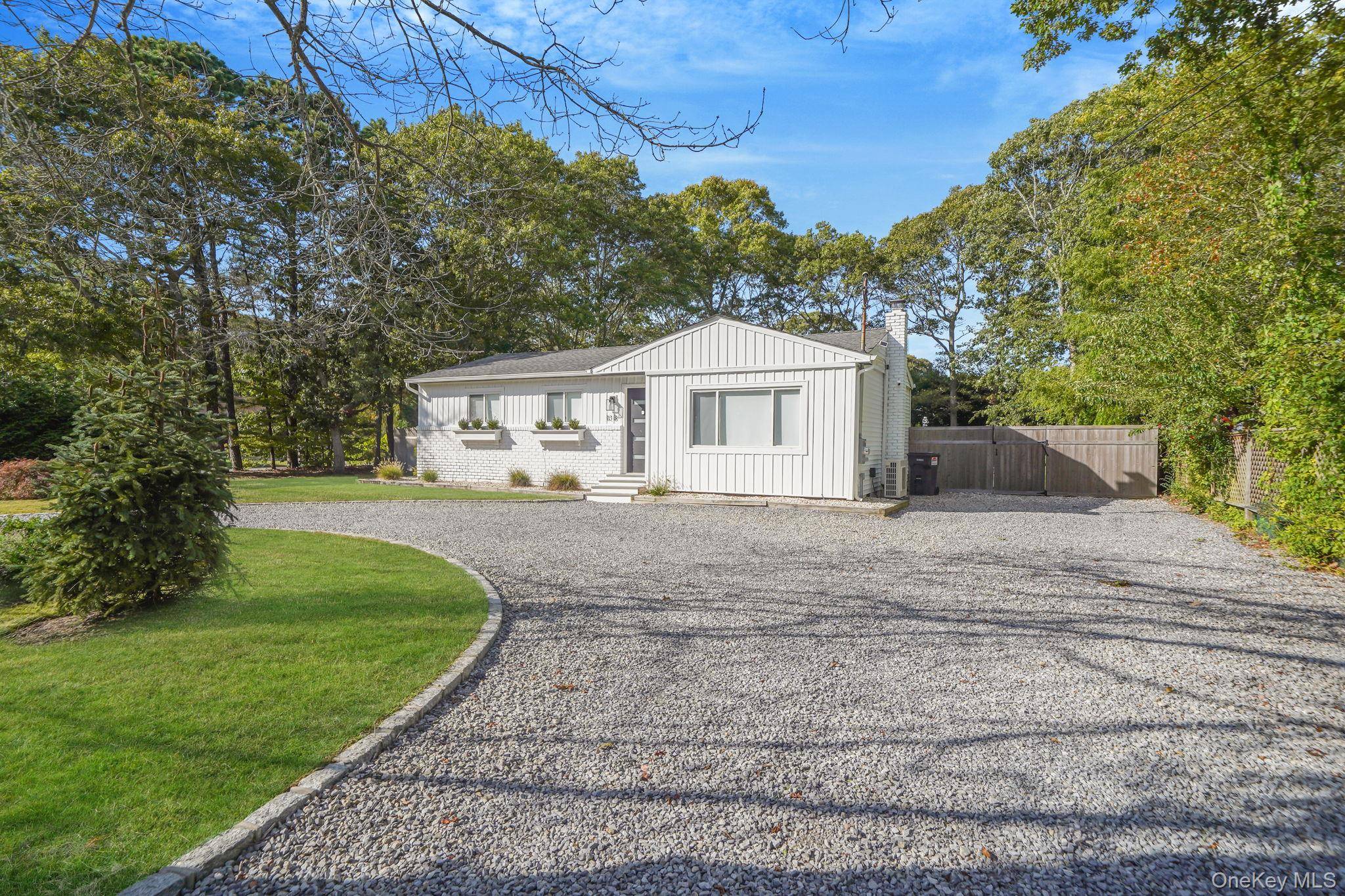 OFFERED AS OFF SEASON RENTAL NOT YEAR ROUND Welcome to 138 West Tiana Road, Hampton Bays, where your perfect Hamptons getaway starts here.