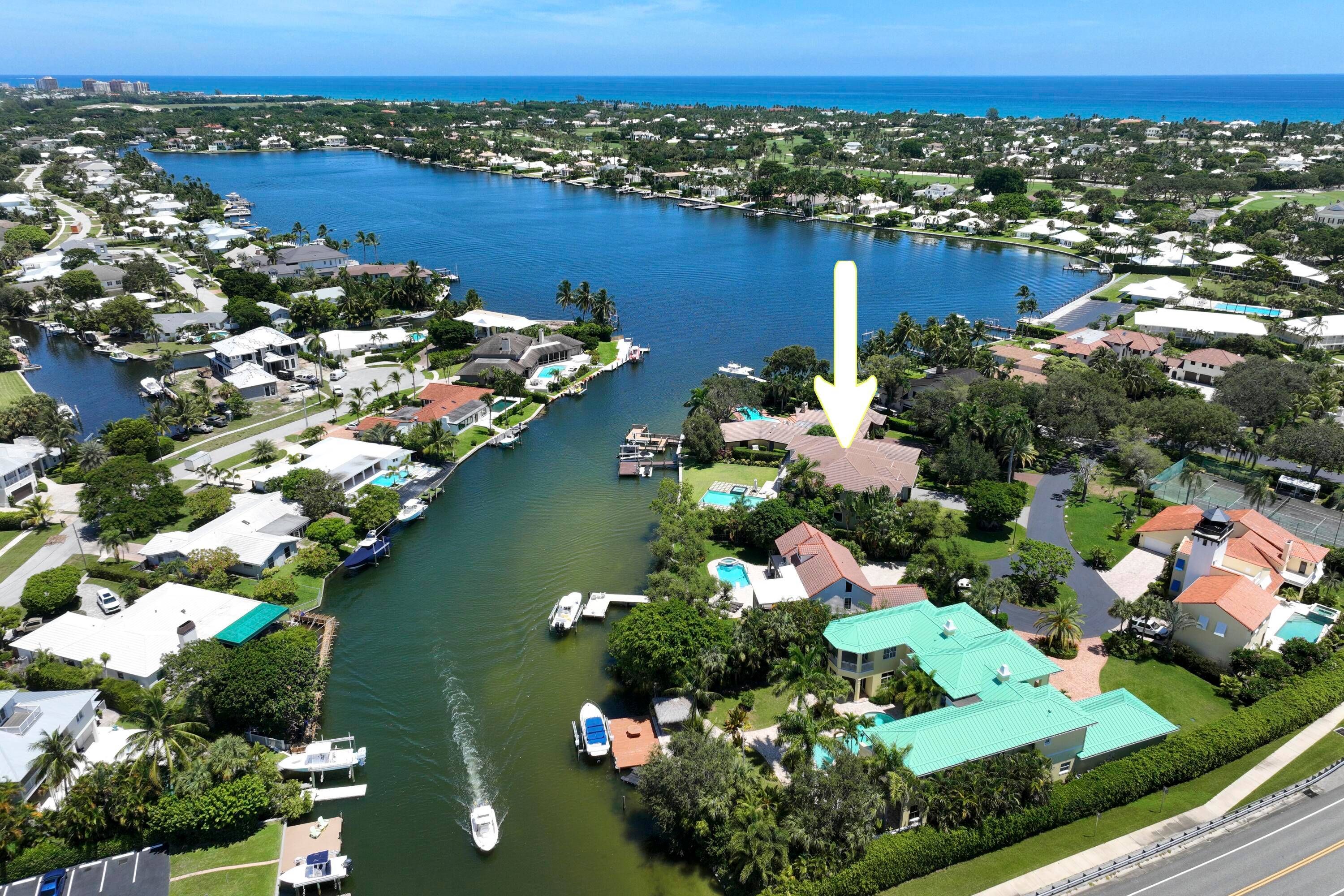 Discover timeless elegance in this stunning two story waterfront estate located in the gated community of Portage Landing.