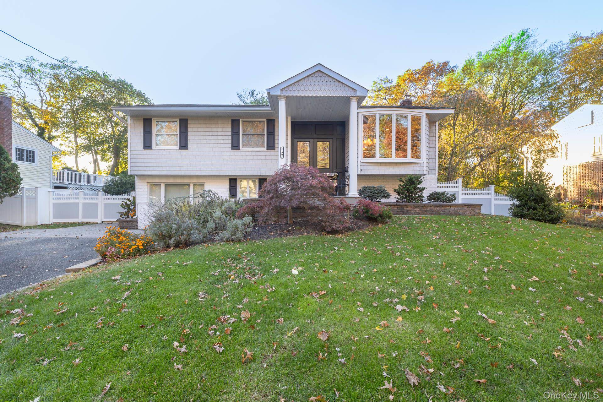 Welcome to this expanded high ranch featuring an open and modern floor plan.