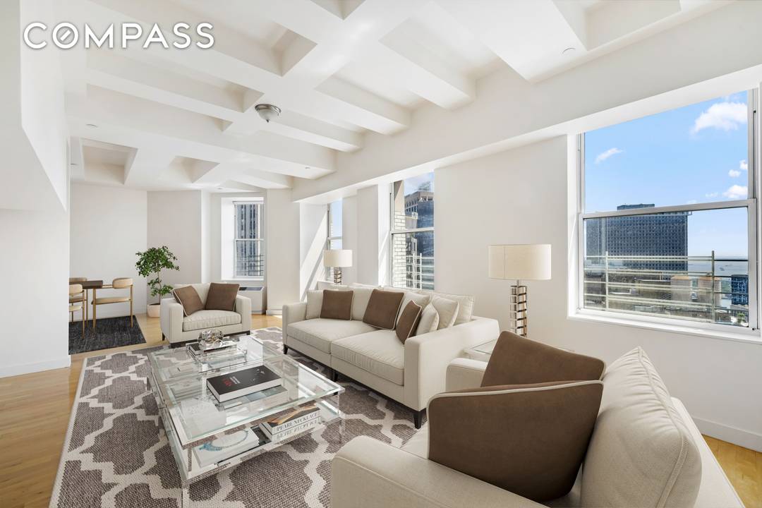 Welcome to an exquisite duplex penthouse located on Broad Street in Manhattan's iconic Financial District.