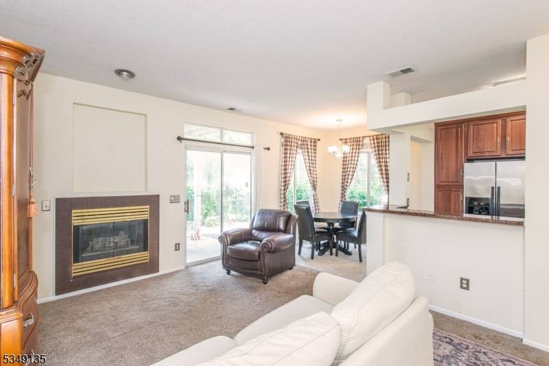 First floor corner end unit with lots of light, nice location close to parking with leafy views from the patio.