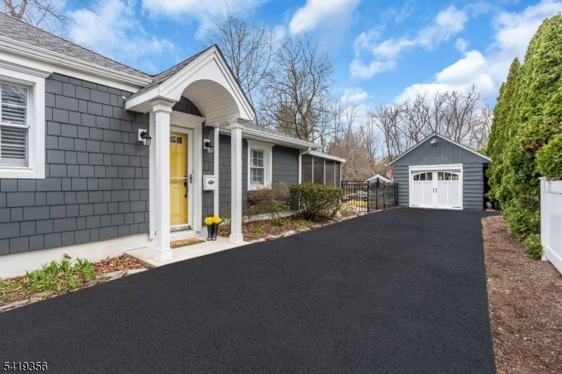 Charming updated cottage in sought after Ridgewood, blending timeless appeal with modern comfort.