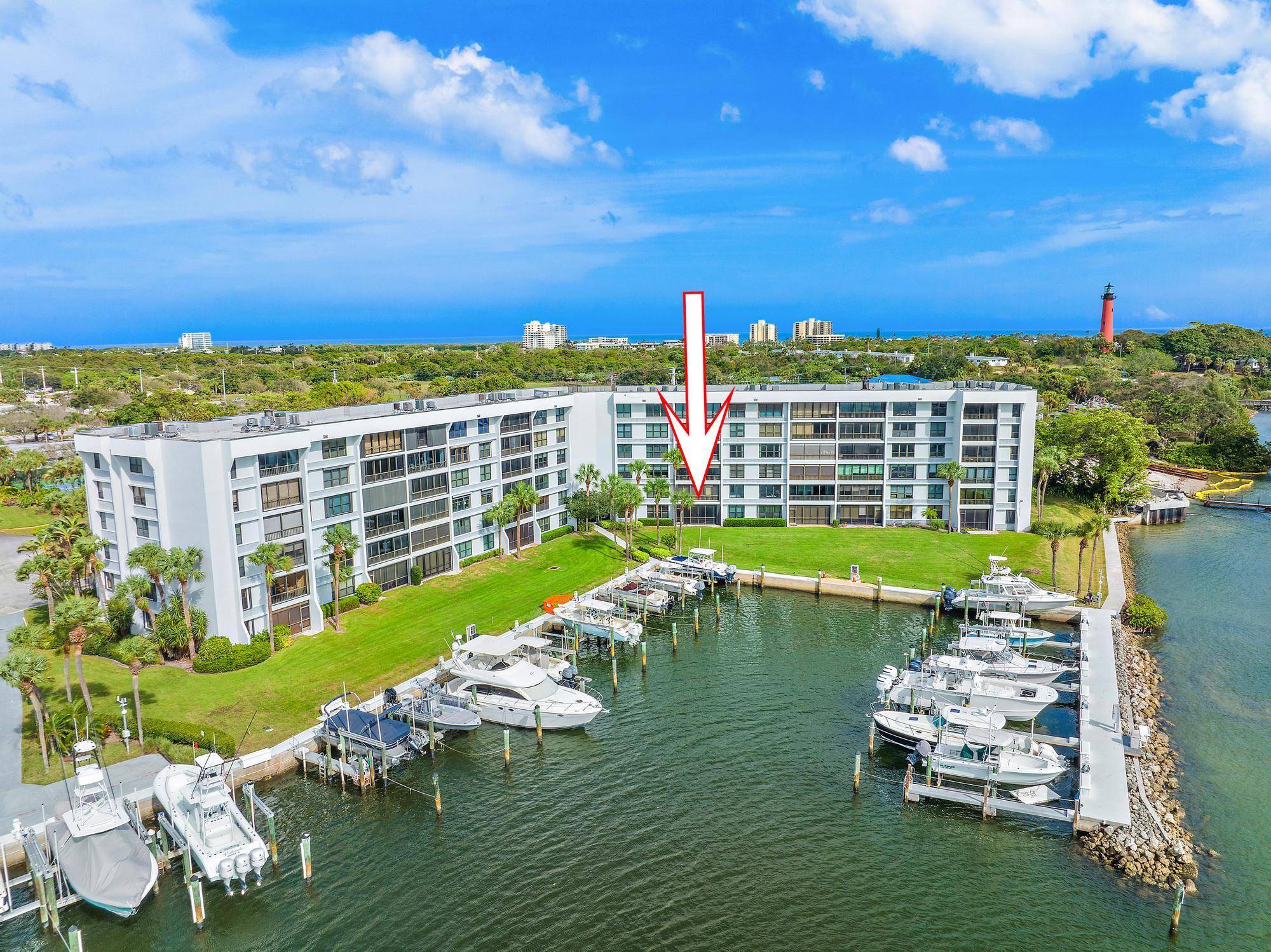 Enjoy amazing views of Jupiter Inlet and the Intracoastal from this gorgeous waterfront condo in Jupiter Cove.