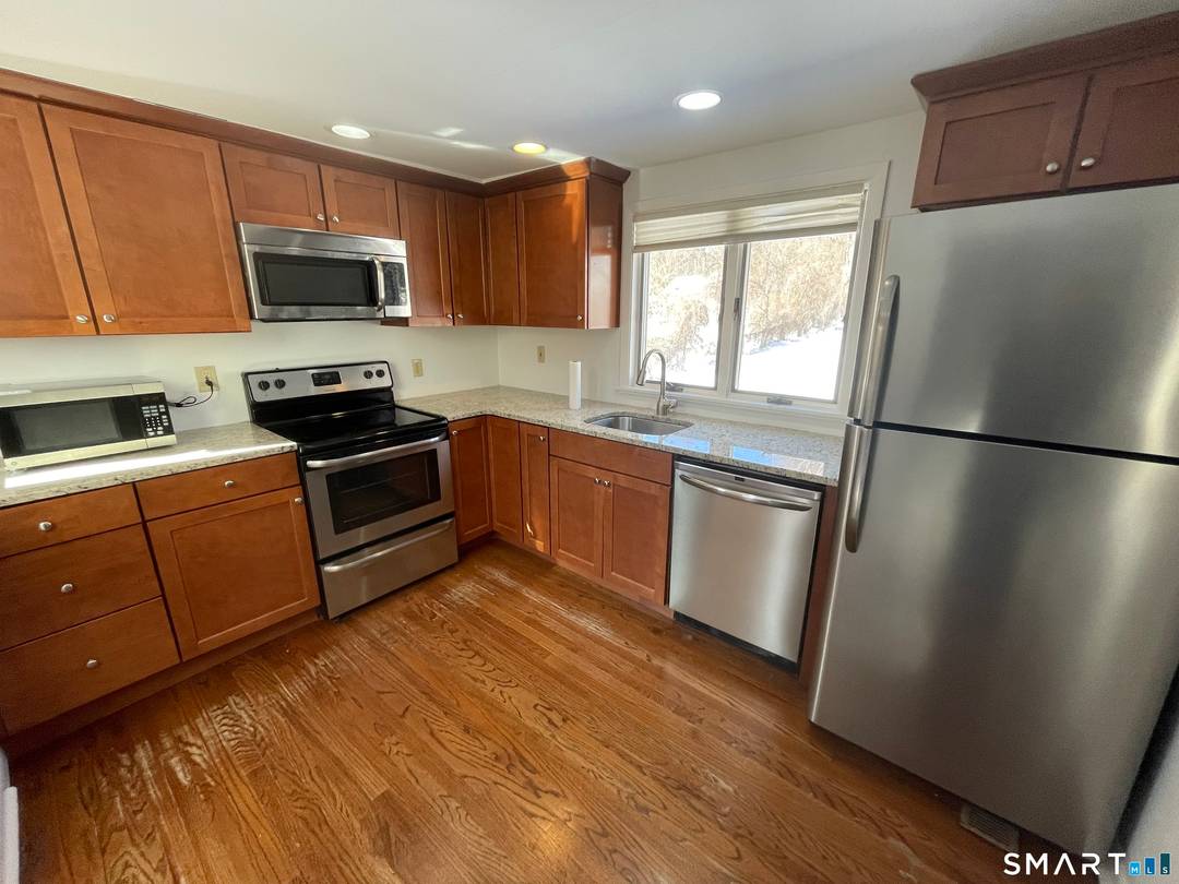 This 2 bedroom 1 and a half bath cottage with two floors of living has a living room with vaulted ceilings and 2 skylights that fill the open space with ...