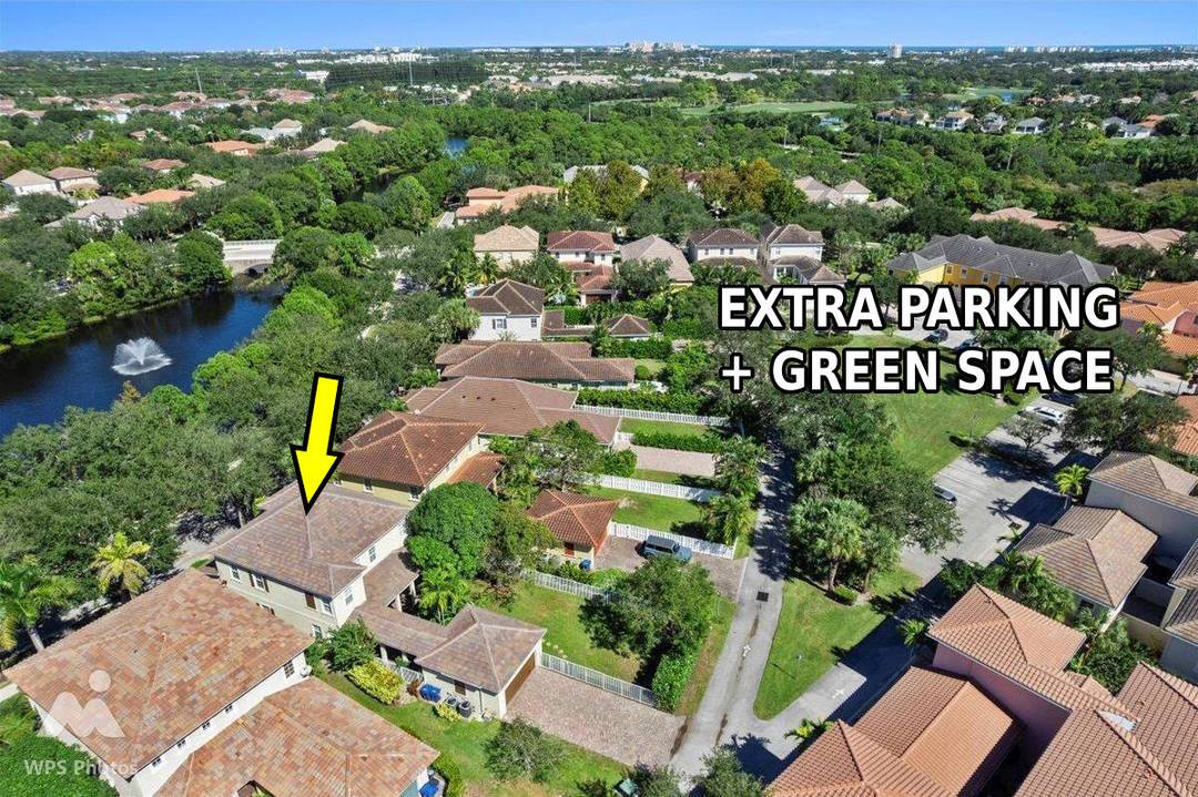 Versatile 4 br, 3 ba Abacoa residence with sparkling LAKE VIEWS on a premium 1 4 ACRE LOT offering endless possibilities !