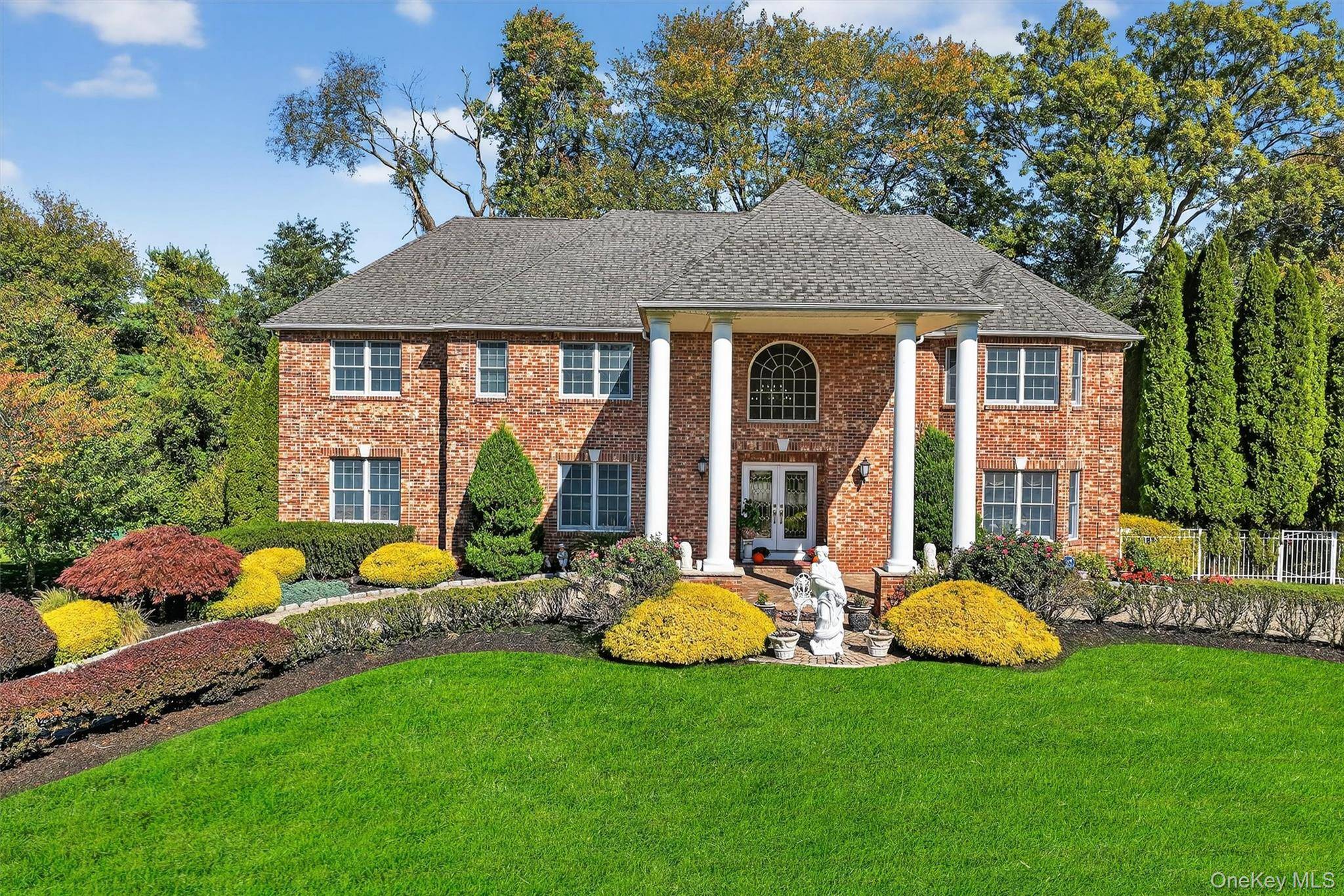 Elegant Georgian Colonial Residence in prestigious Camelot Estates Community in New City.