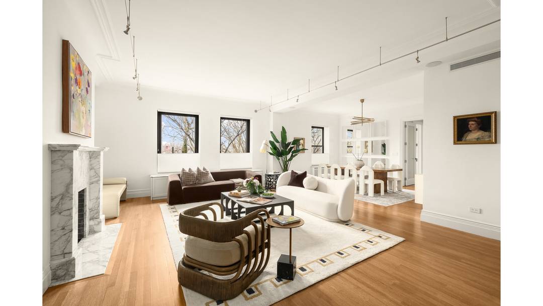 Sunset light pours across the Hudson River and into this remarkable duplex at The Clarendon.