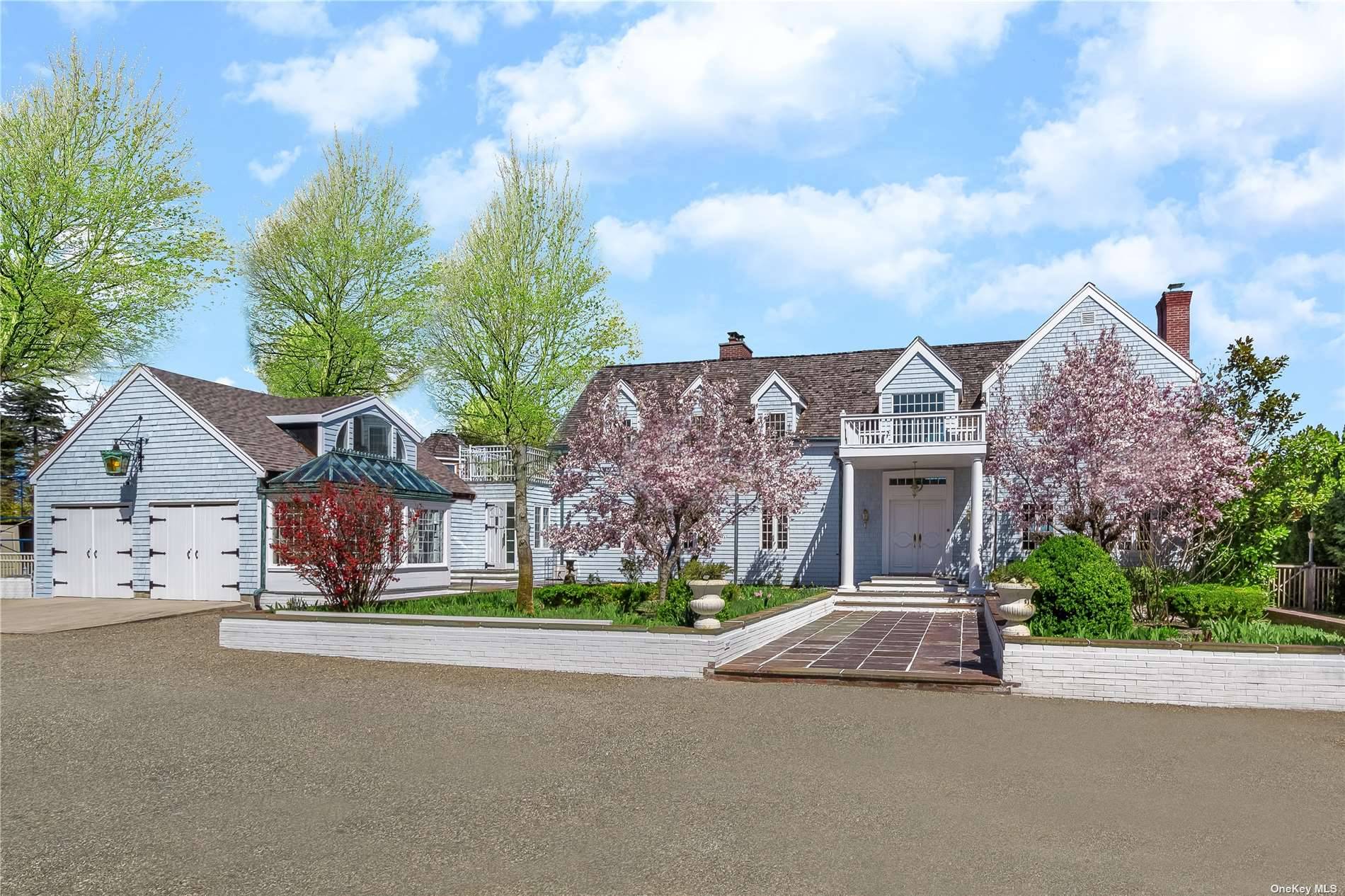 Standing tall behind a gated entrance and manicured gardens, this 5 bedroom, 6 full bath residence offers the rare privacy of a grand single family home located just 2, 100 ...