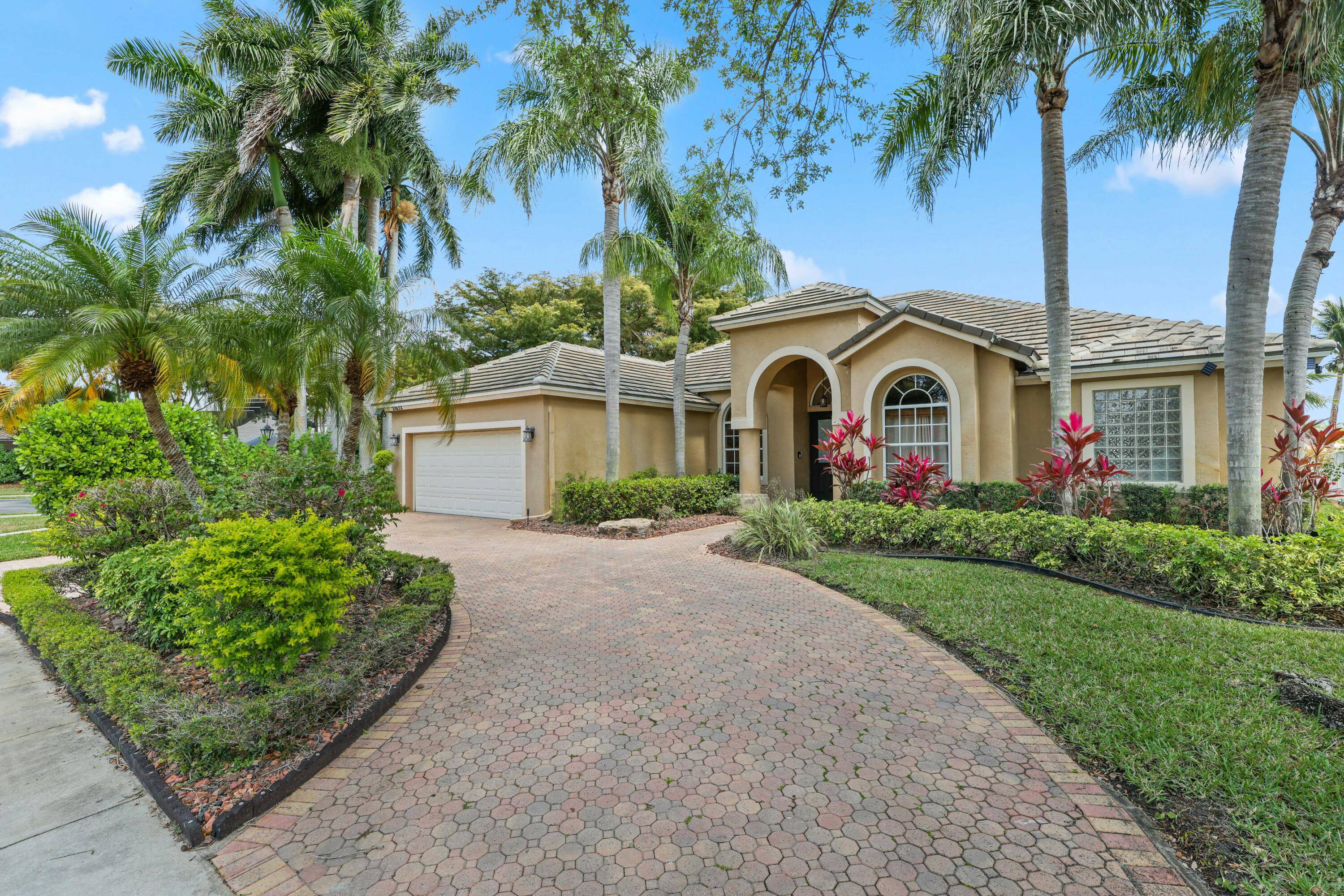 Experience luxurious lakefront living in this stunning 4 bed, 3 bath home with 2, 731 sq ft of elegance, set on an oversized corner lot in Boca Falls.
