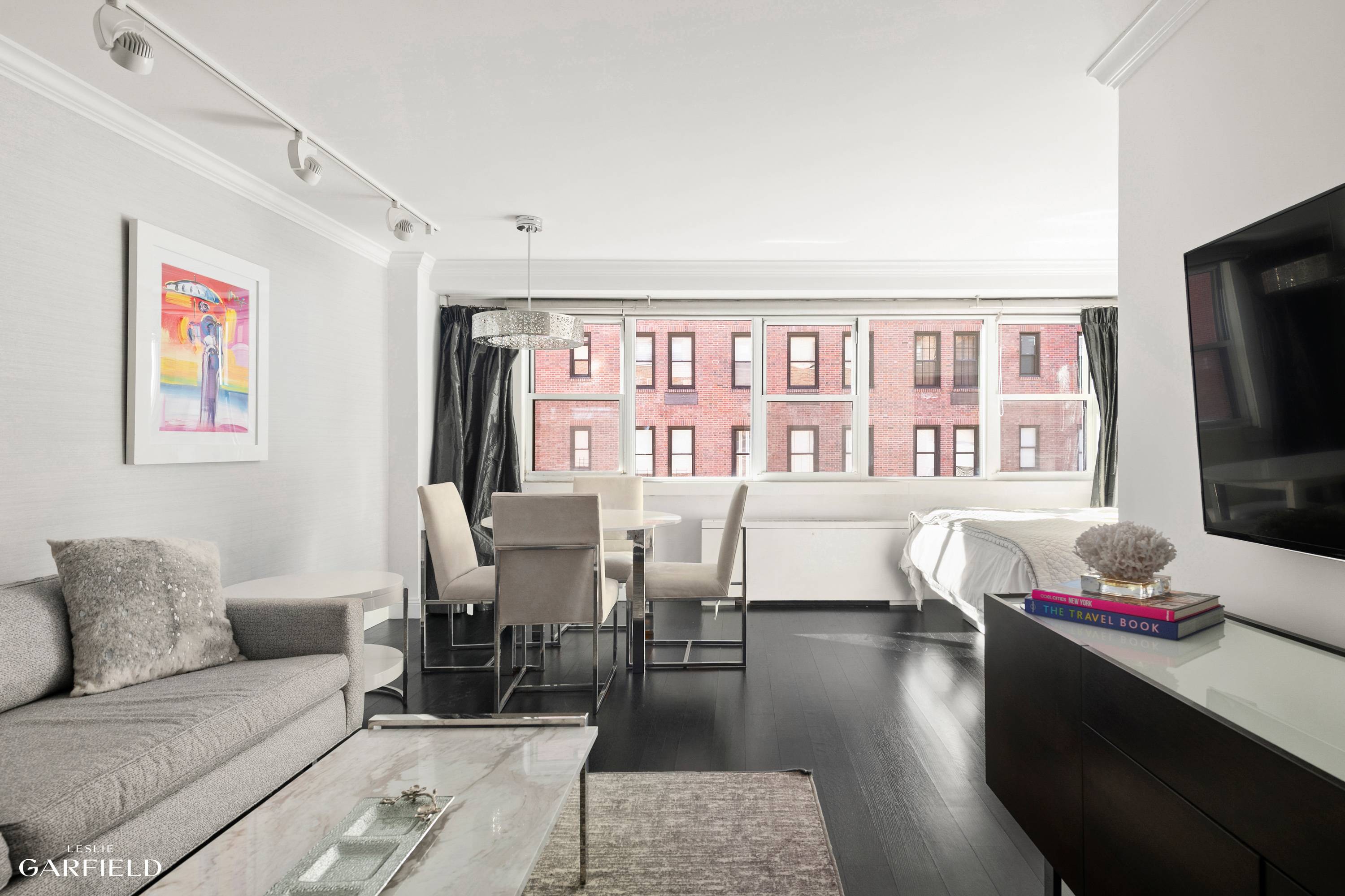 Welcome to this sophisticated and fully renovated extra large alcove studio in the heart of the Upper East Side, nestled on tree lined 75th Street between Park and Lexington Avenue.