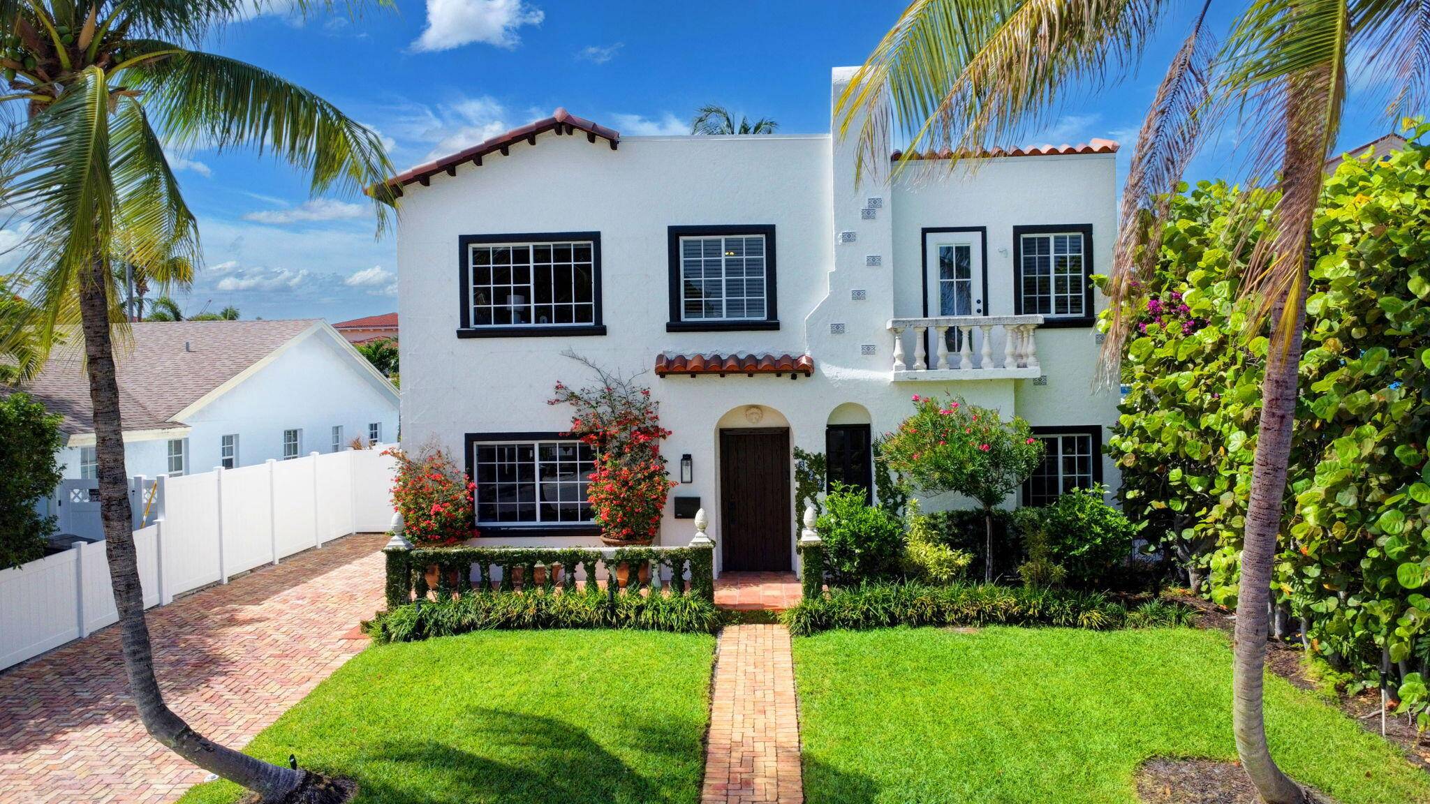 Step through the lovingly restored Pecky Cypress door of this 1923 impressive dwelling, into a modernly updated home.