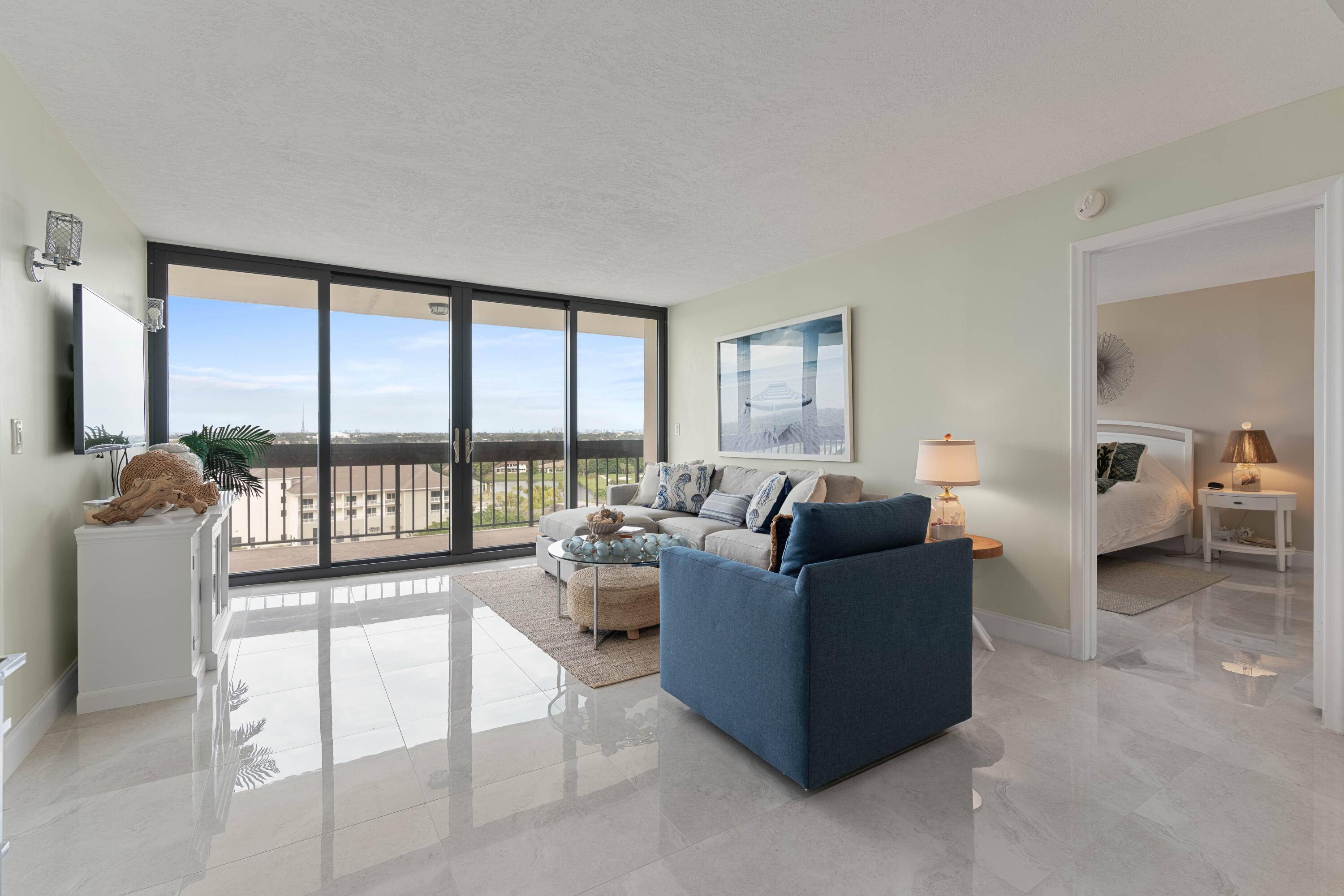 Completely renovated 2 Bedroom 2 Bath middle building unit with spacious balcony overlooking the Nicklaus design Banyan Cay Golf Course and Resort and Lake Mangonia.