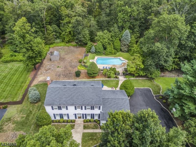 Perched on 1. 3 private acres in the sought after mountaintop community of Sunset Ridge, this west facing four bedroom Colonial effortlessly combines comfort, style, and setting.