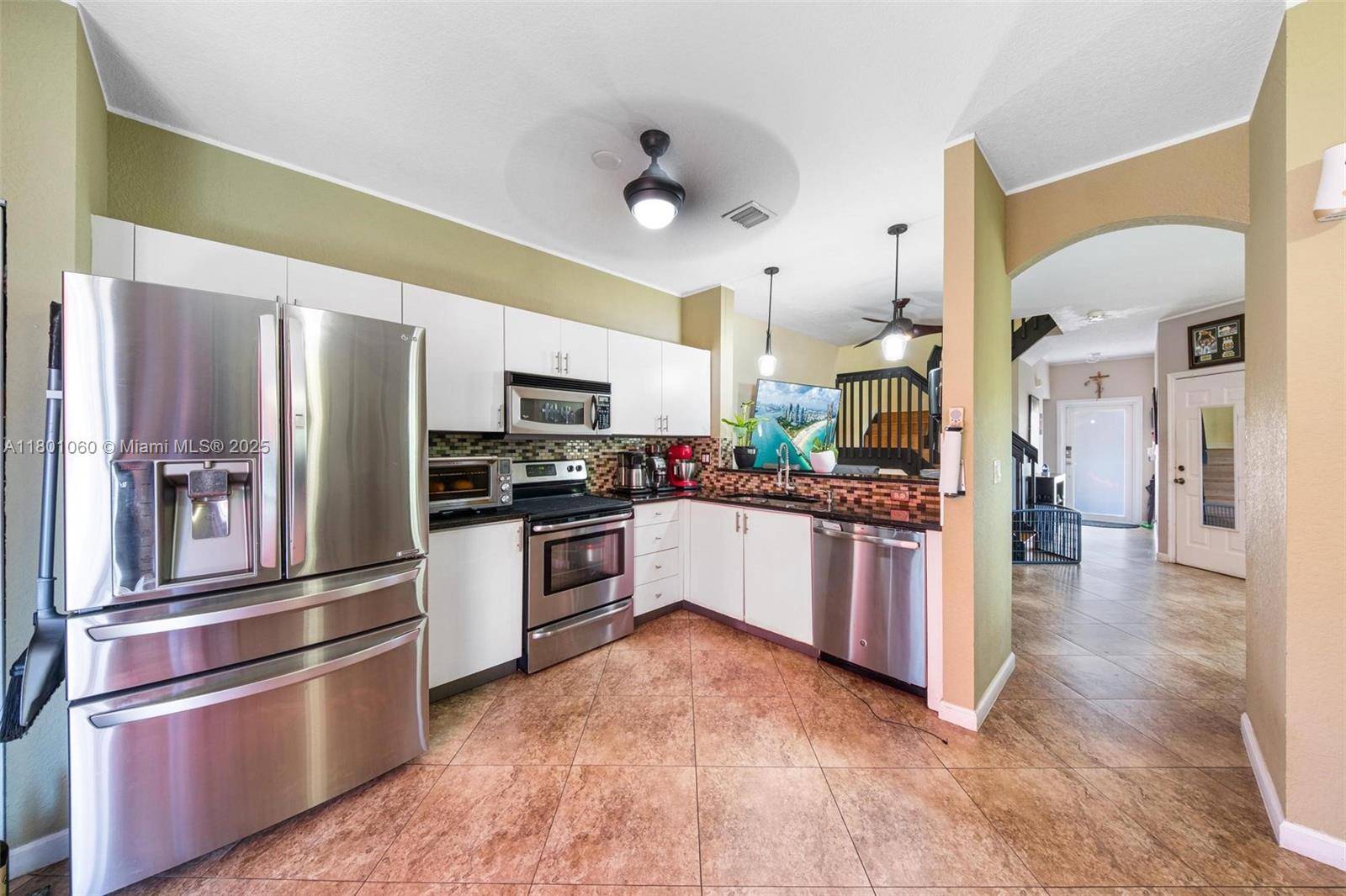 Spacious 4BD 2. 5BA corner townhome in a cul de sac with larger backyard fenced with water view.