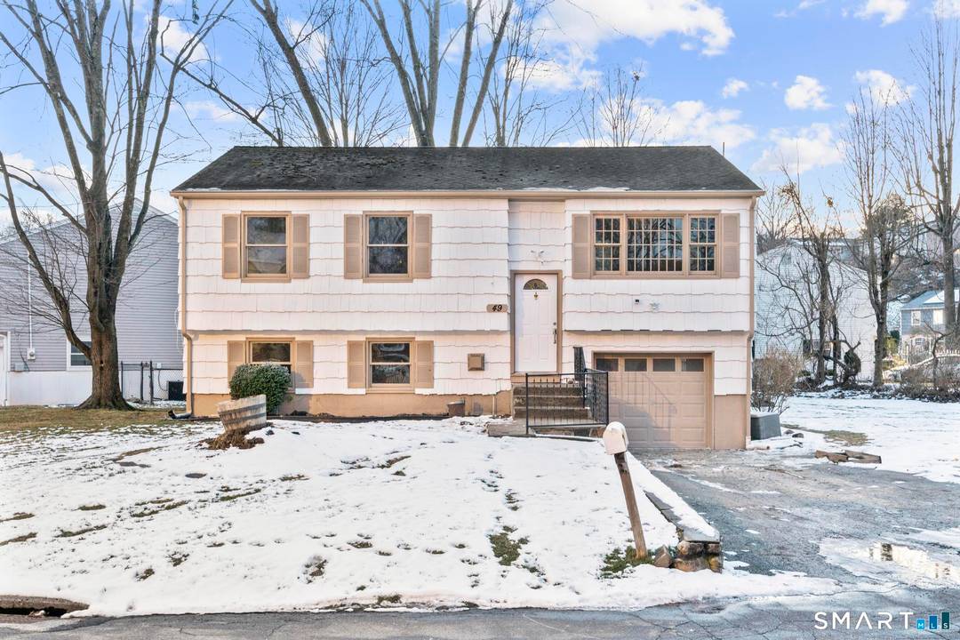 Welcome to 49 Sleepy Hollow Drive, an updated raised ranch set on a desirable corner lot, offering modern upgrades, flexible living space, and excellent New York commuter access.