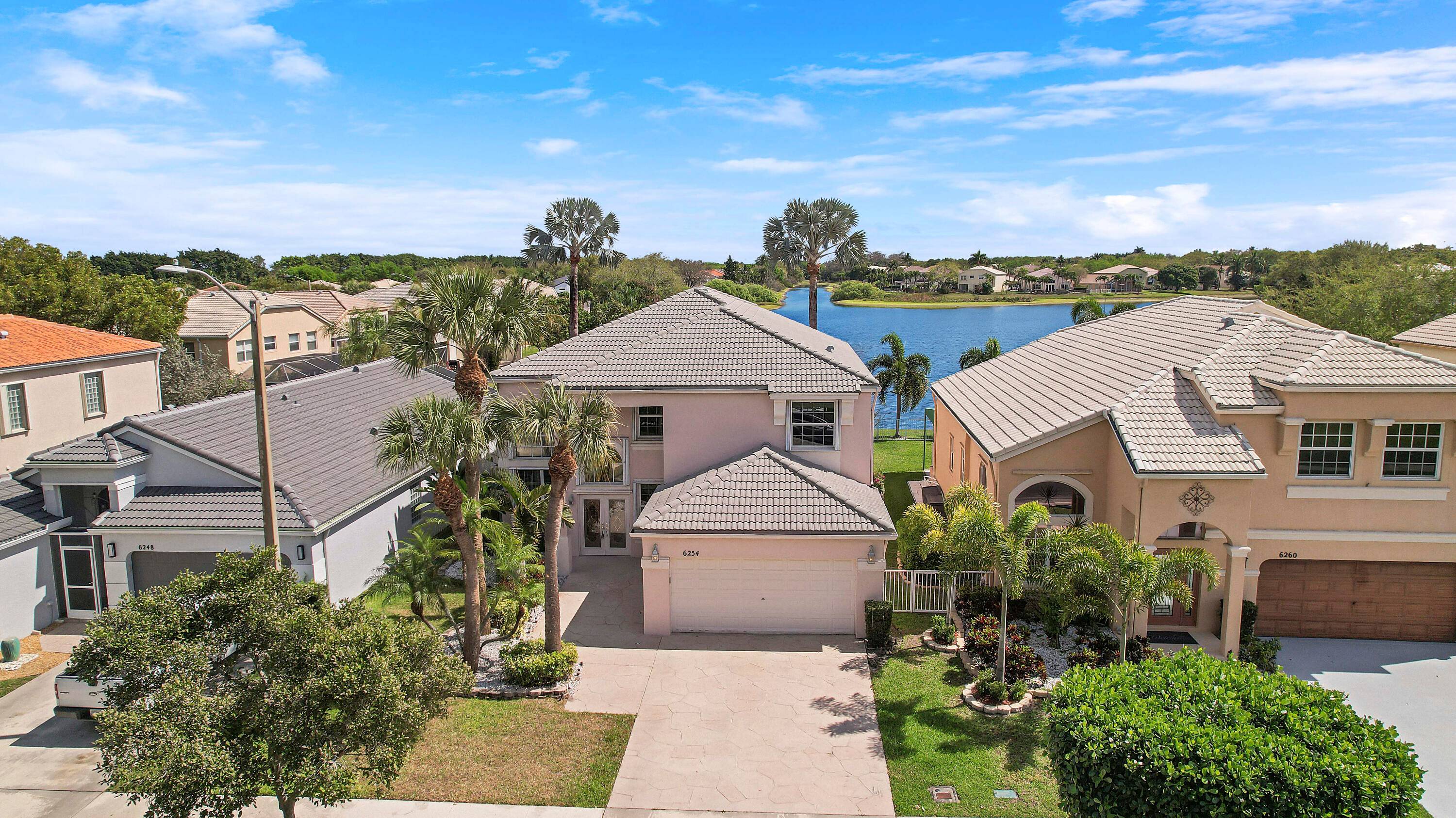 Nestled on a premium waterfront lot, LARGEST LAKE in the community, this 6 bedroom, 4 bathroom, OFFERS UNPARALLELED LUXURY.