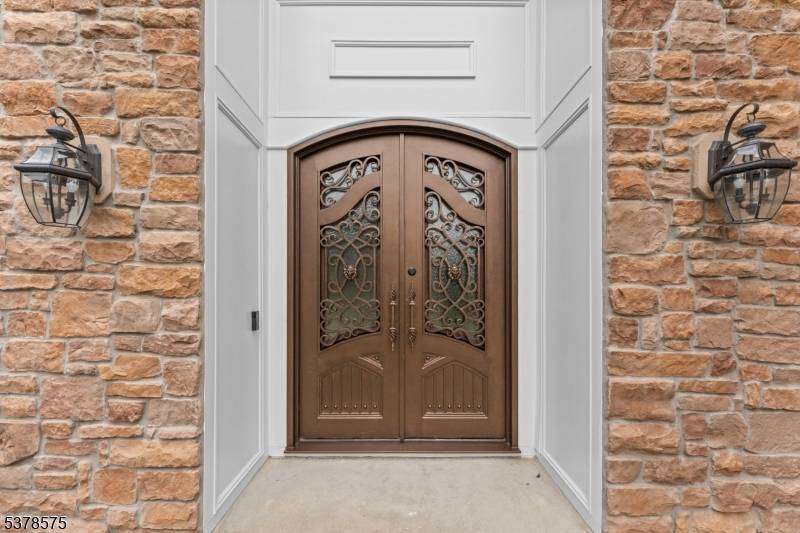 As you enter the two story foyer you will be impressed by the curved stairway and Schonbek chandelier w motorized lift.