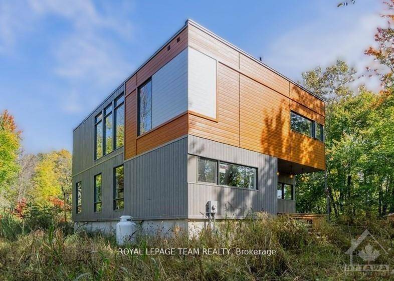 This modern luxury dream home is sitting on a peaceful 1.