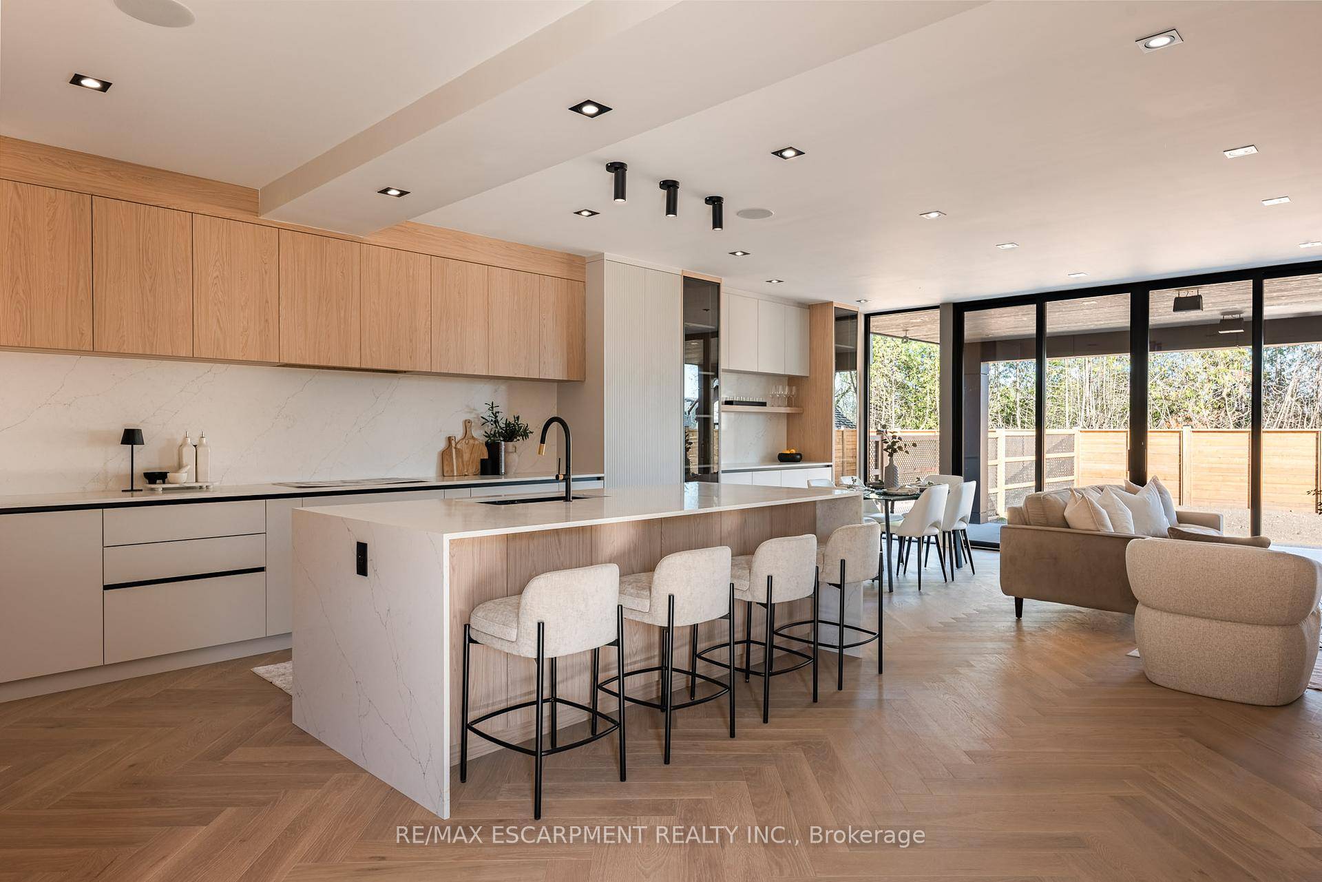 Step into this architecturally striking luxury residence, expertly crafted by Montbeck Developments, where exceptional design and meticulous craftsmanship span all three levels.