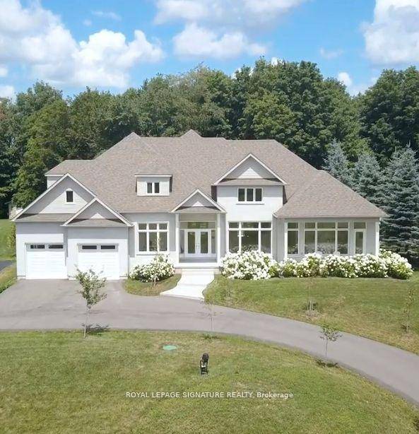 Stunning custom built bungaloft on a private, just over 1 acre hilltop lot in Claremont with 12 ceilings in the great room, 10 ceilings on main, and 9 ceilings in ...