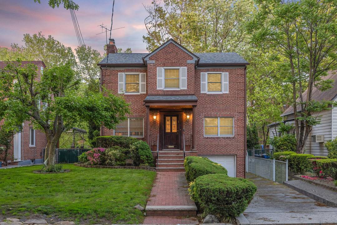 Welcome to 86 49 Dunton Street, a large brick Tudor style center hall colonial ideally situated on a completely flat 5969 sqft lot in the heart of Holliswood, Queens.