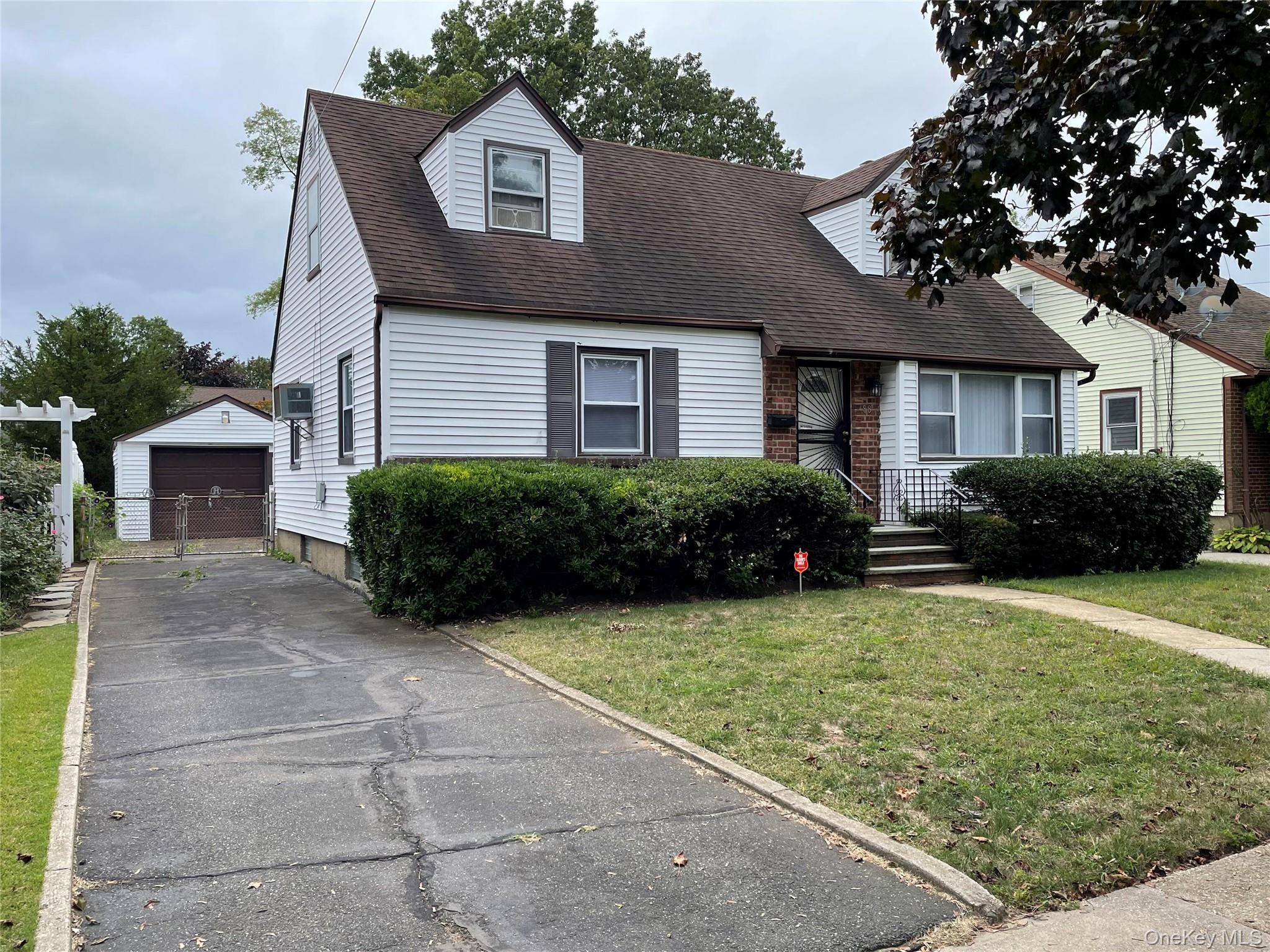 Welcome to this charming 4 bedroom, 2 bath Cape nestled in the heart of Uniondale.
