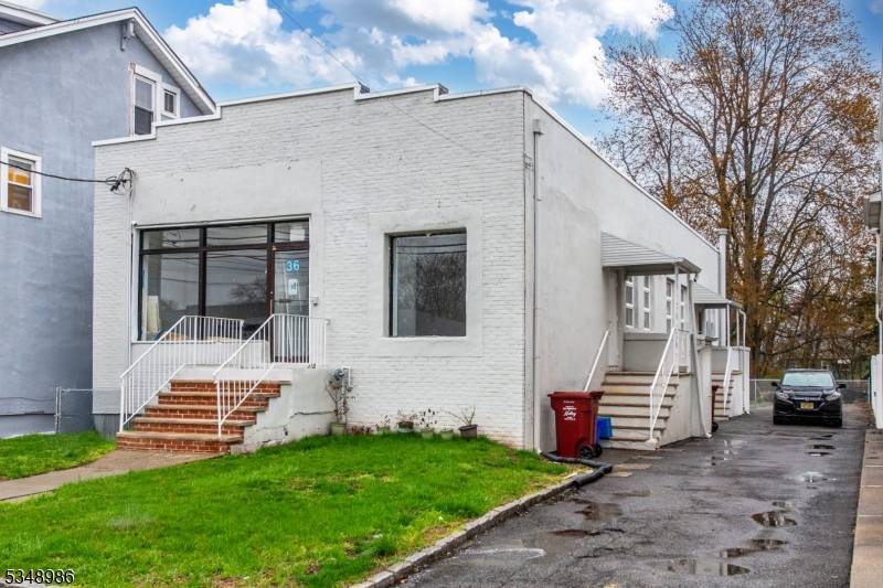 This mixed use property offers a commercial storefront, previously a Domino's Pizza and a full apartment on the same level.