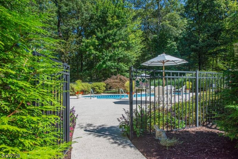 Nestled in the Knightsbridge neighborhood of Randolph, this exceptionally maintained Colonial home offers the perfect blend of elegance, comfort, resort style living.