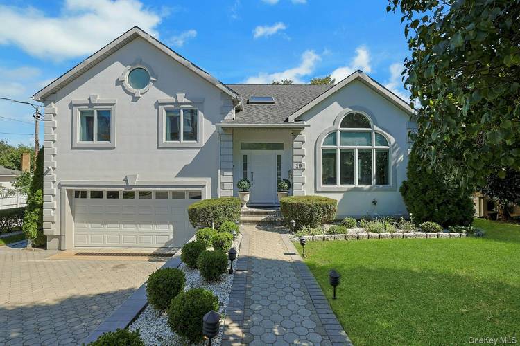 This beautiful, spacious and meticulously maintained stucco colonial offers 4 bedrooms, 2.