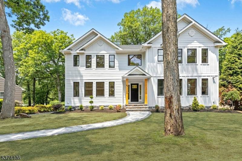Experience refined living in this stunning new Craftsman style home featuring five spacious bedrooms, five full bathrooms, and a powder room.