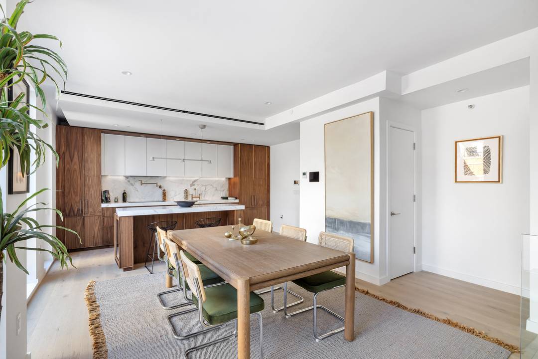 This townhouse inspired home is an expansive three level garden residence thoughtfully designed to balance openness with privacy, offering a seamless distinction between living, entertaining, and restful spaces.