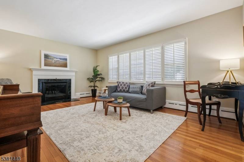 Perfectly positioned on one of Chatham's most sought after streets, just blocks from town, train, and top rated schools, this deceptively spacious 5 bedroom, 3.