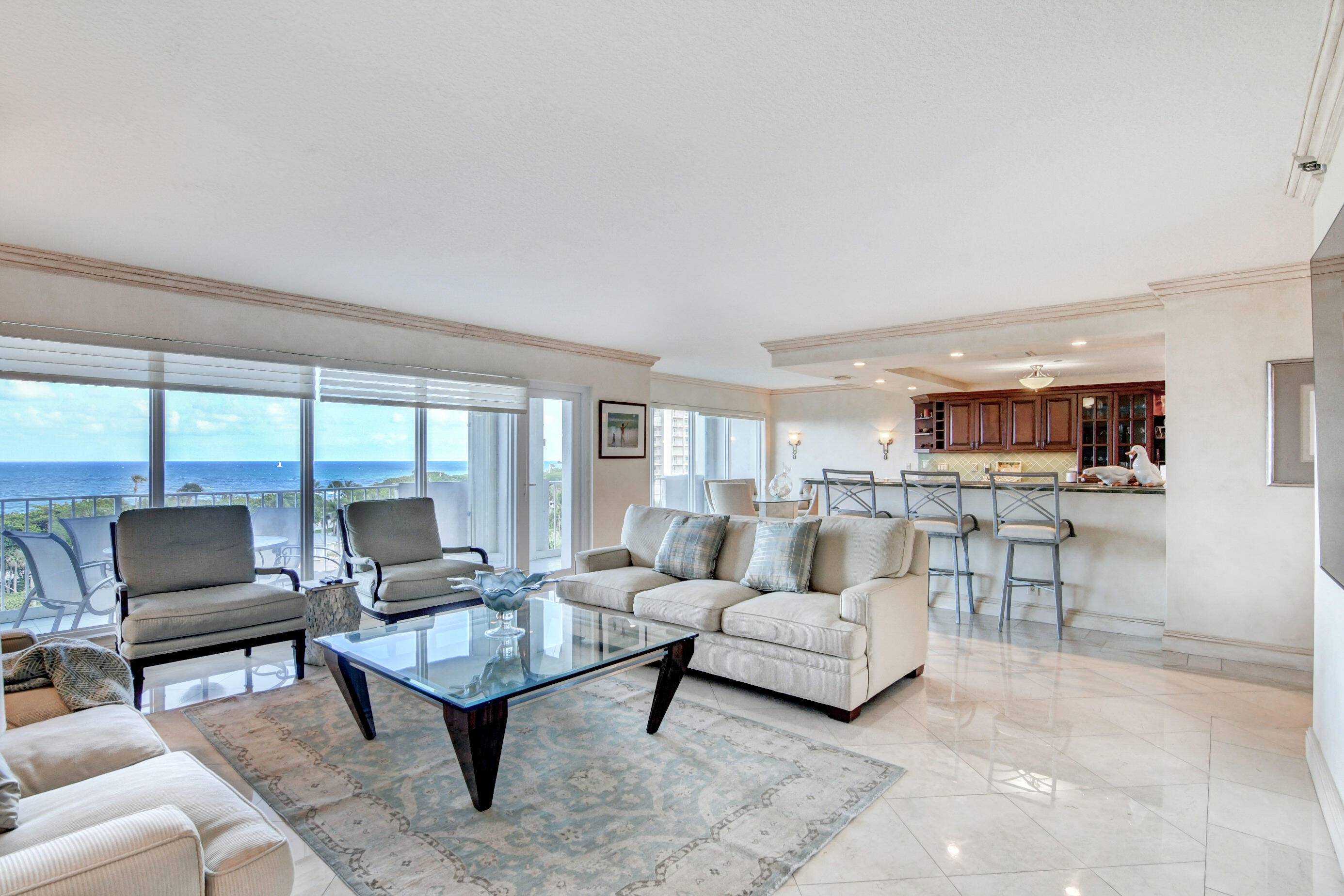 THIS TURNKEY CONDO IS IN IMACULATE CONDITION WITH MARBLE WOOD FLOORS THROUGHOUT !
