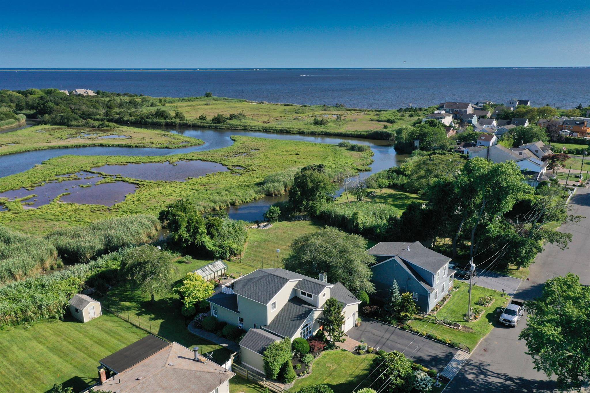Welcome to 243 South Dunton Avenue, East Patchogue, NY where charm meets breathtaking views !