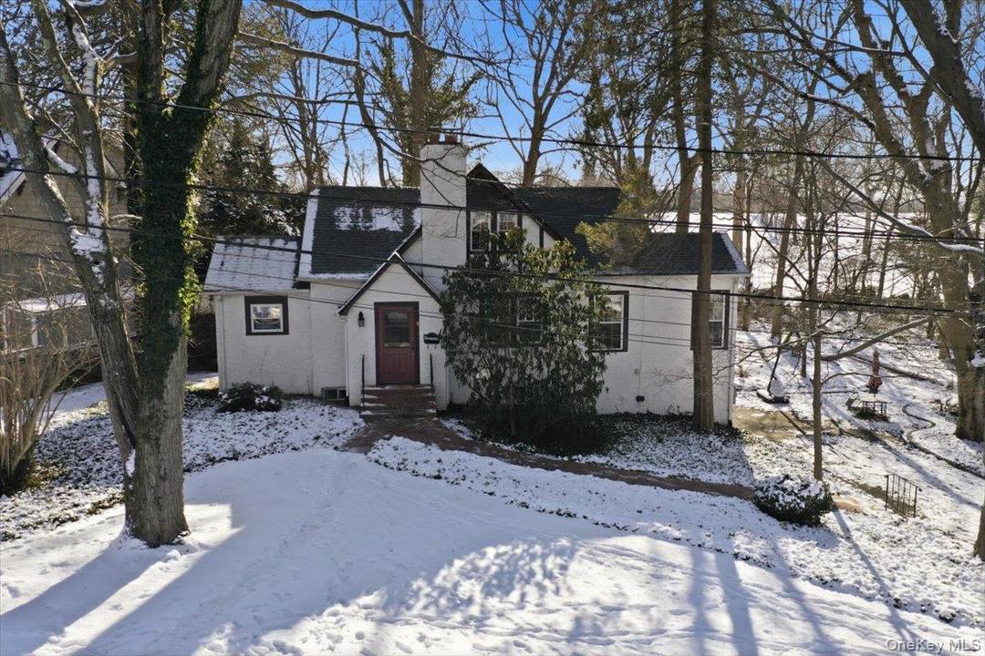 Welcome to an exceptional offering at 11 Muriel Road in the prestigious Manhasset Bay Estates section of Port Washington, where refined North Shore living meets rare coastal privileges.