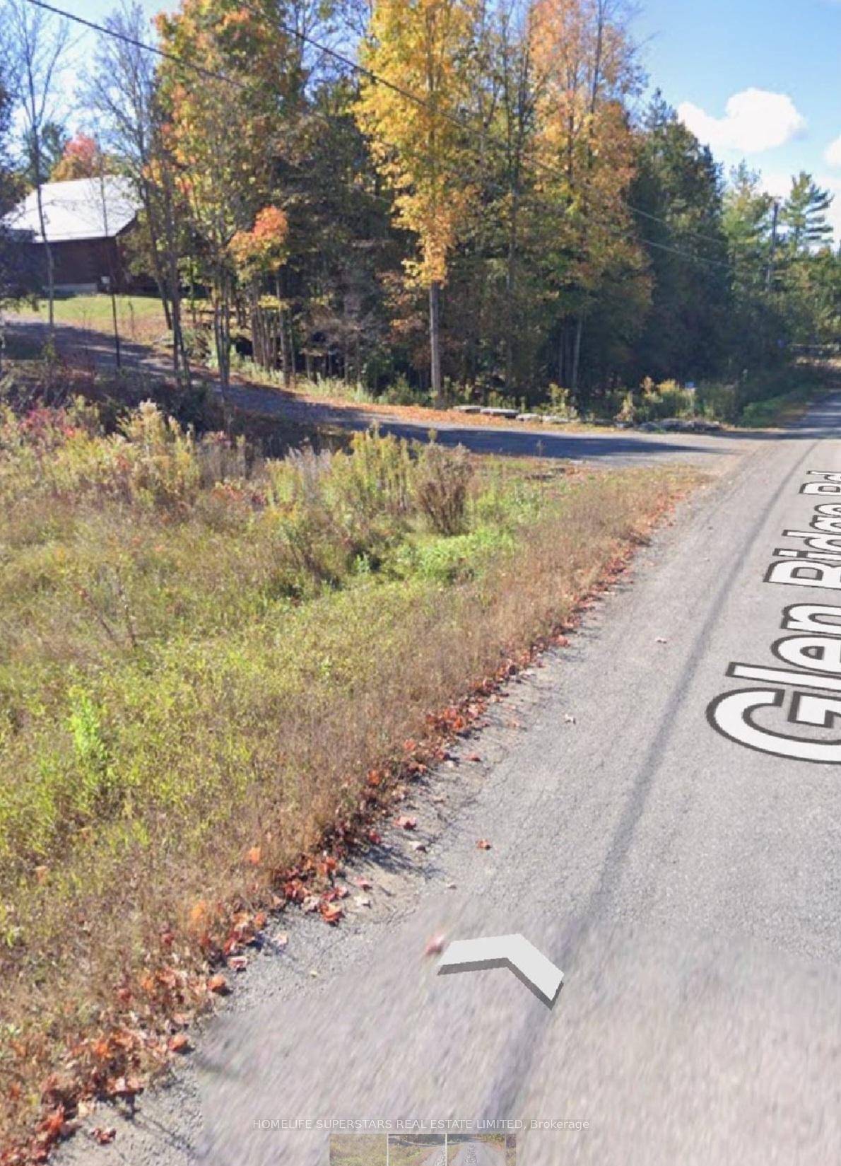 Treed property has 1 acre Vacant lot in the town of Marmora.